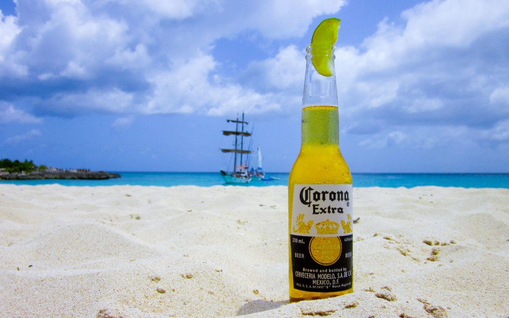 Bottle Of Beer In The Sand Looking Out To Sea